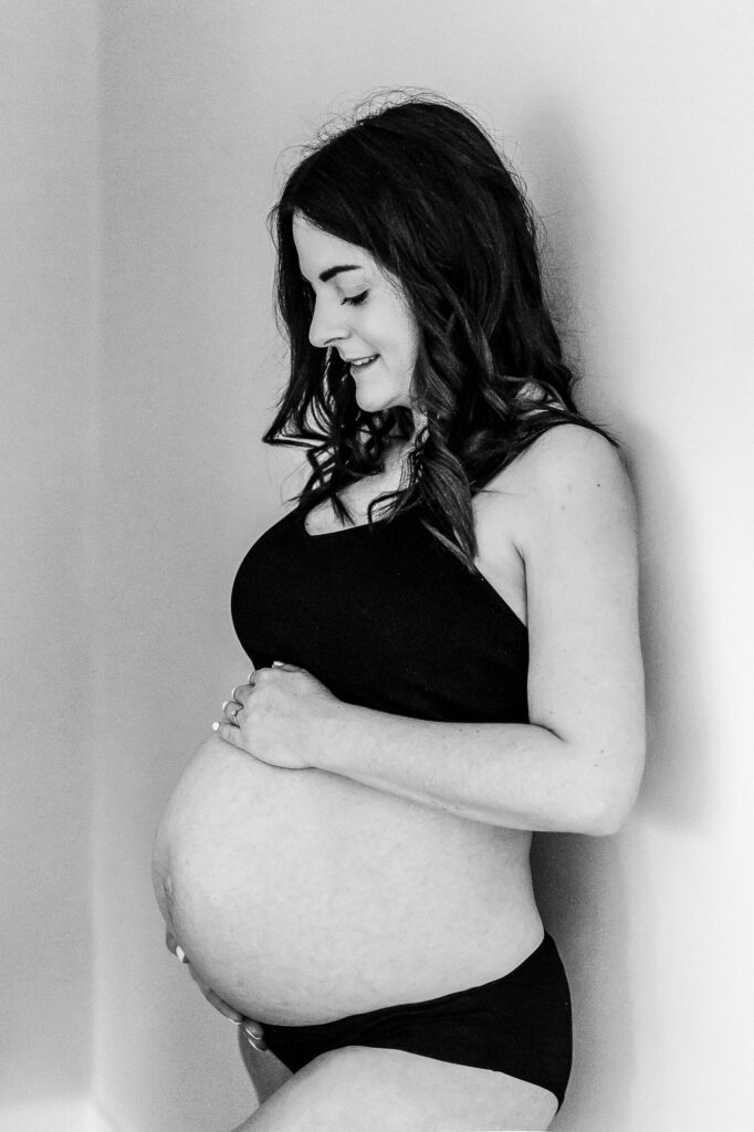 maternity photo of woman in home at Farnham