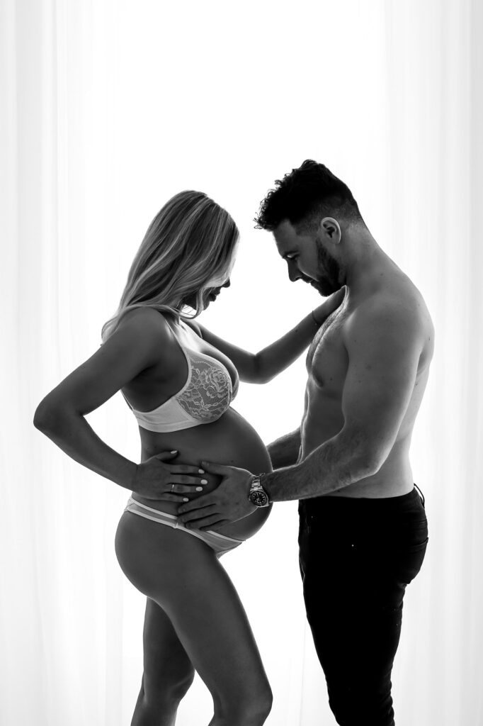 photos of couple while pregnant in cranleigh