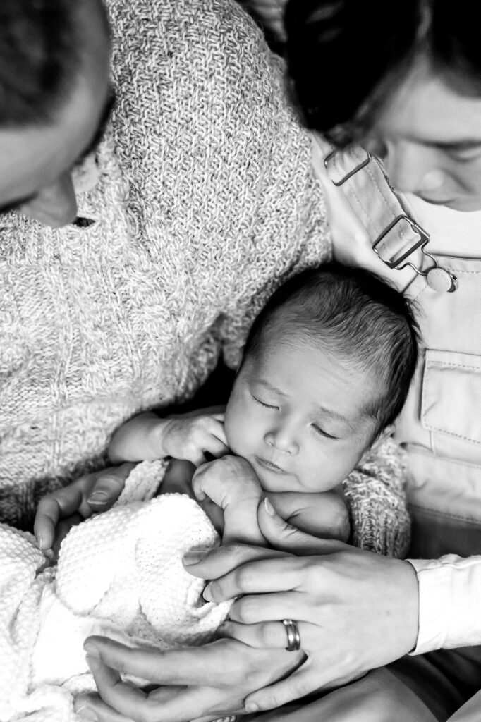 newborn baby with parents in Farnham home