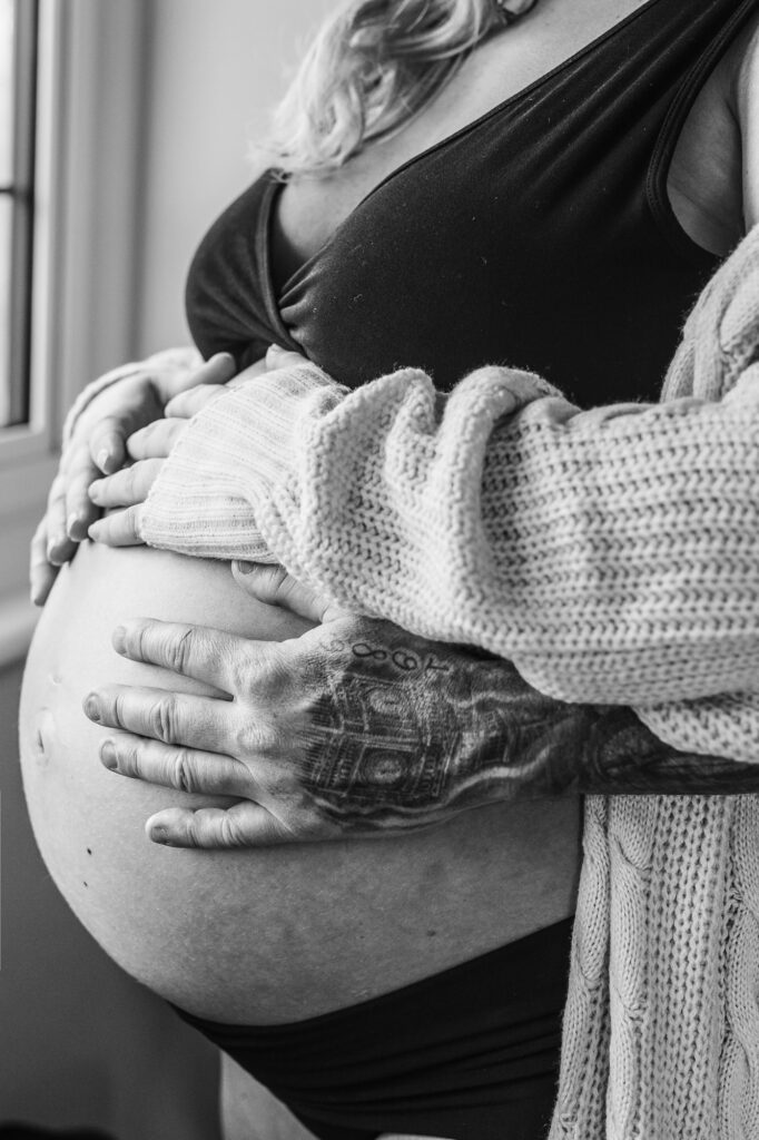 Father and mother hands with pregnant bump photos in Haslemere