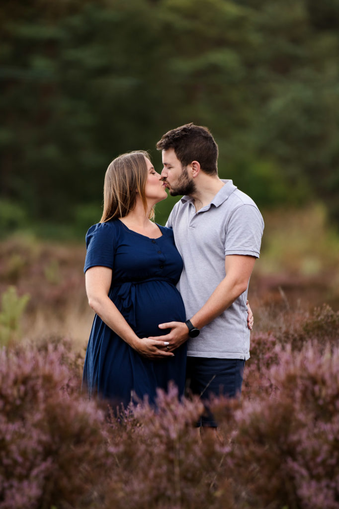 Pregnant couple outdoors in Guildford