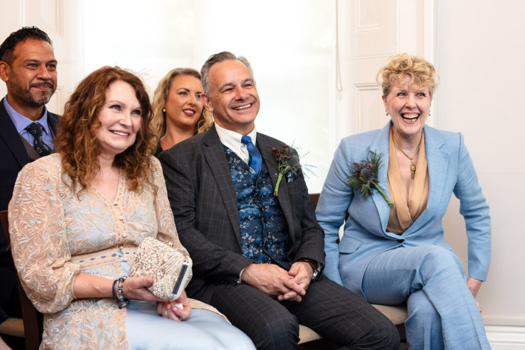Farncombe guests at a wedding smiling